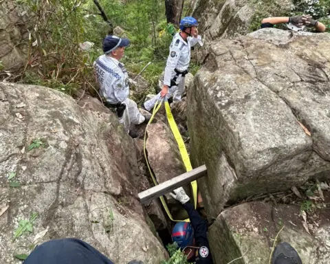 Woman wedged upside down between rocks for 7 hours after trying to retrieve her phone