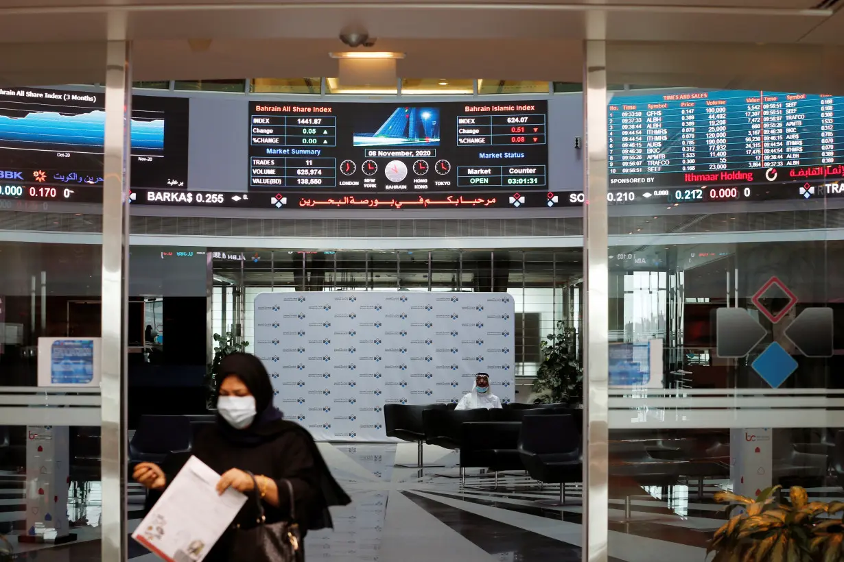 A trader walks out of Bahrain Bourse in Manama