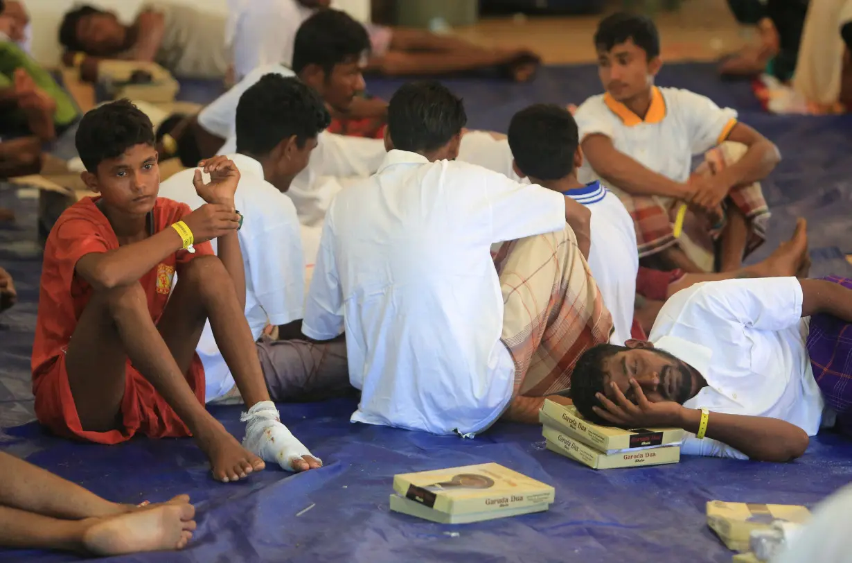 Rohingya refugees rest at the temporary shelter in Suak Nie village following their arrival in the waters of West Aceh