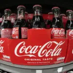 Coke's quarterly revenue as well as sales volumes fall, but still beats expectations