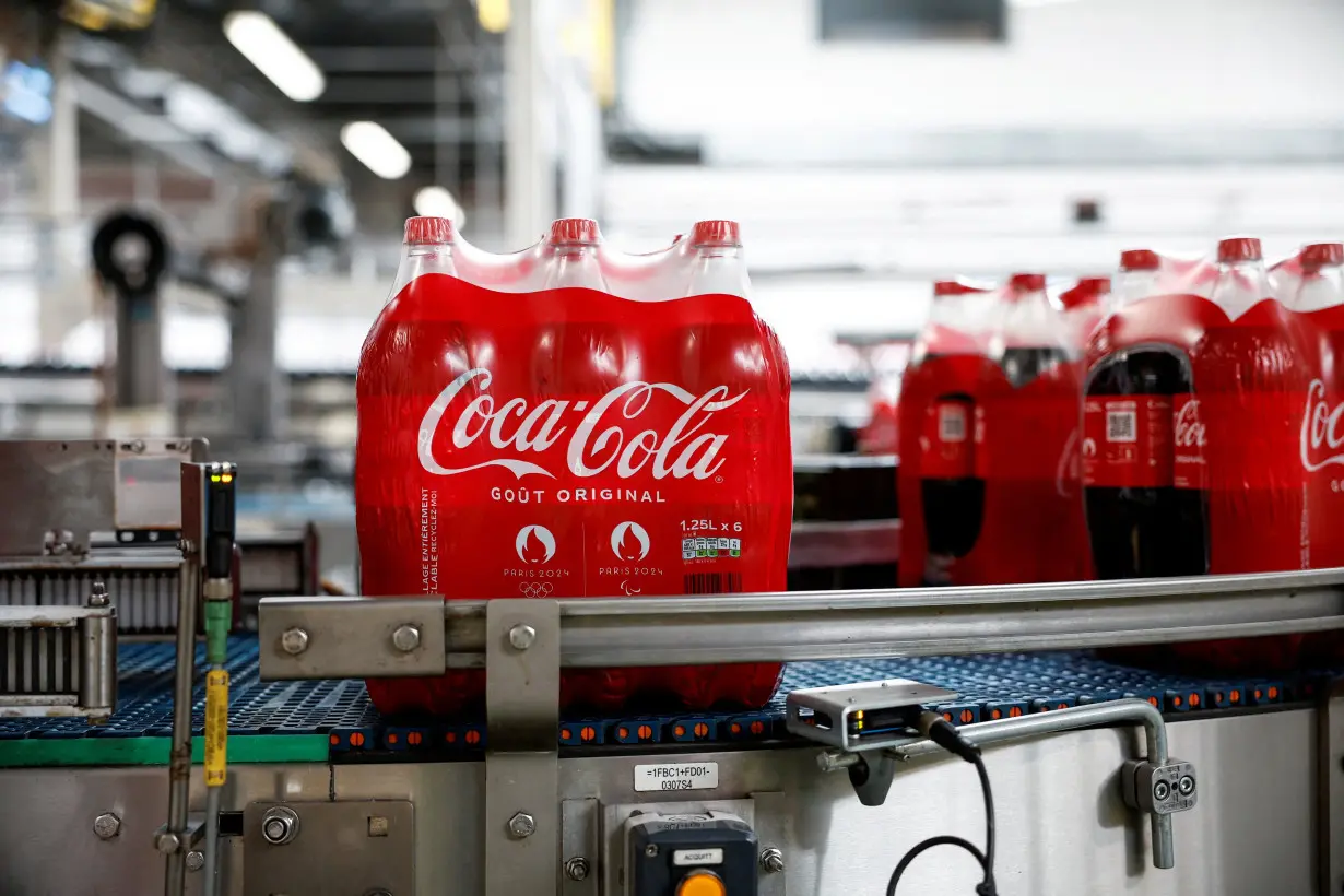 FILE PHOTO: Production line at the Coca-Cola Europacific Partners bottling plant in Les Pennes-Mirabeau, near Marseille