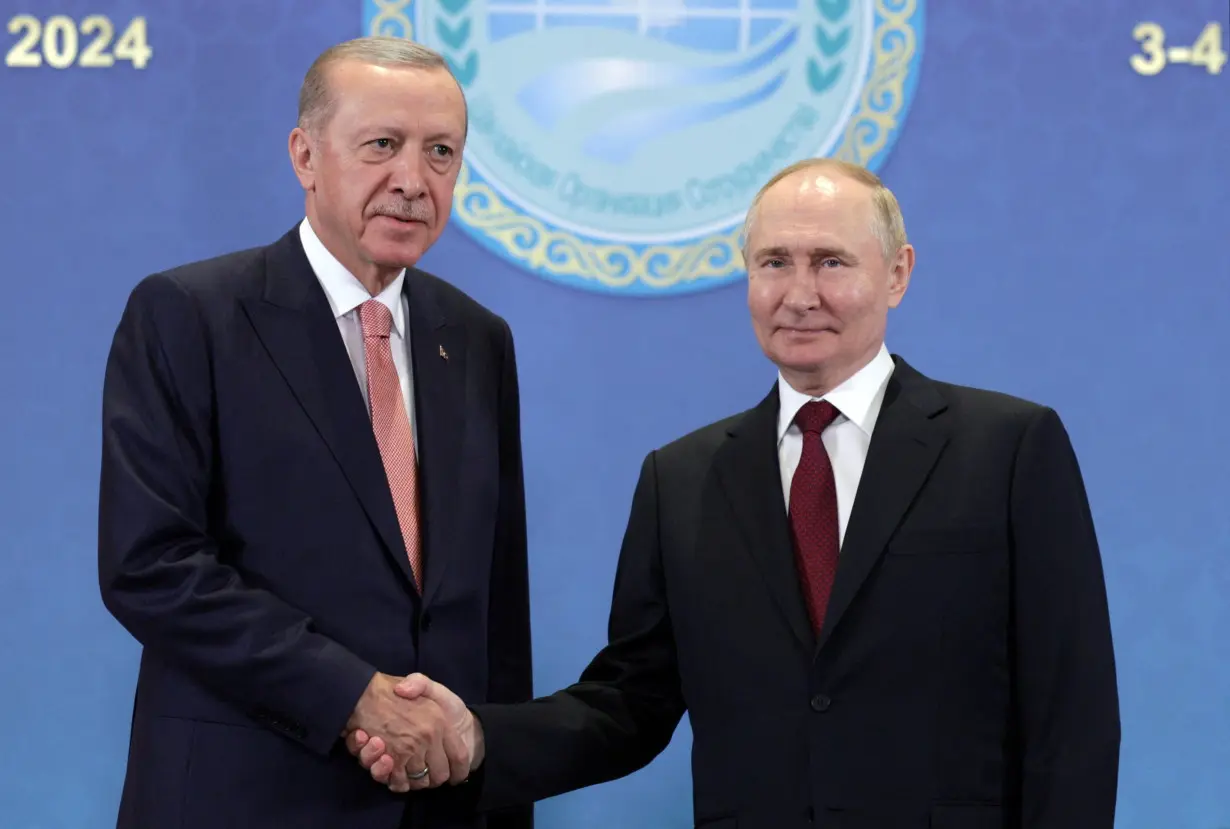 FILE PHOTO: Russian President Putin and Turkish President Erdogan meet in Astana