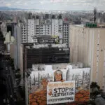 Giant mural in Sao Paulo uses ash from wildfires to highlight deforestation