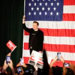 Justice Department warns Elon Musk that his $1 million giveaway to registered voters may be illegal