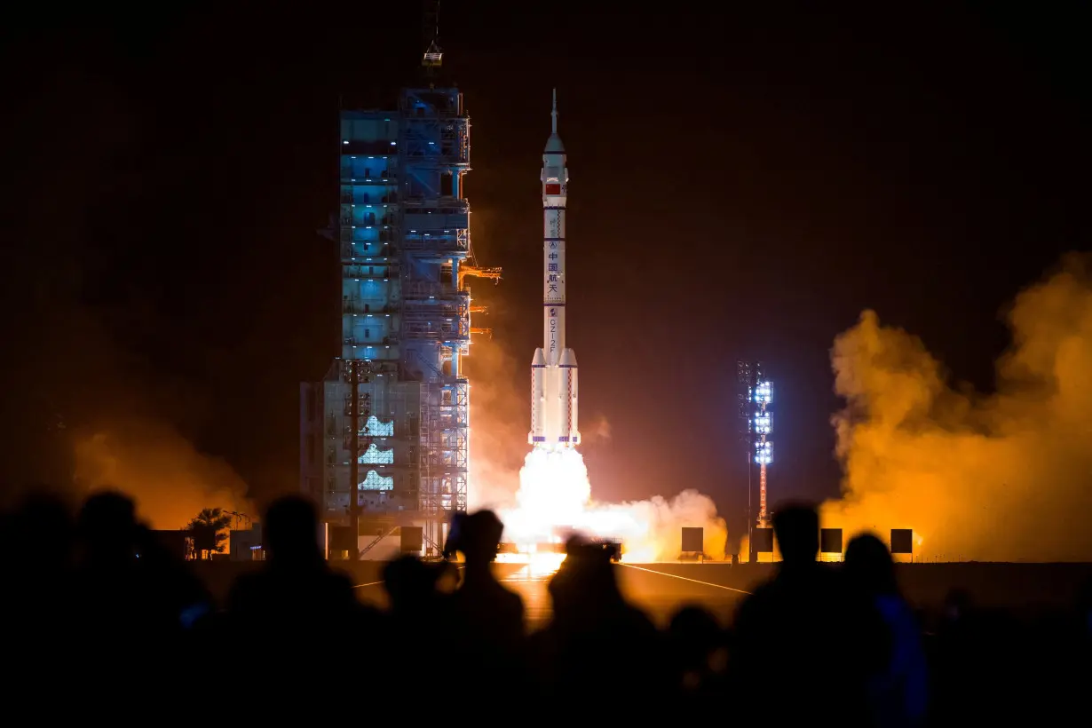 FILE PHOTO: A Long March-2F carrier rocket carrying the Shenzhou-18 spacecraft takes off from Jiuquan Satellite Launch Center