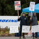 Boeing factory workers reject wage deal, extending strike