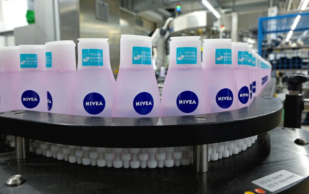 Nivea bottles are seen on a production line at the plant of German personal care company Beiersdorf in Hamburg