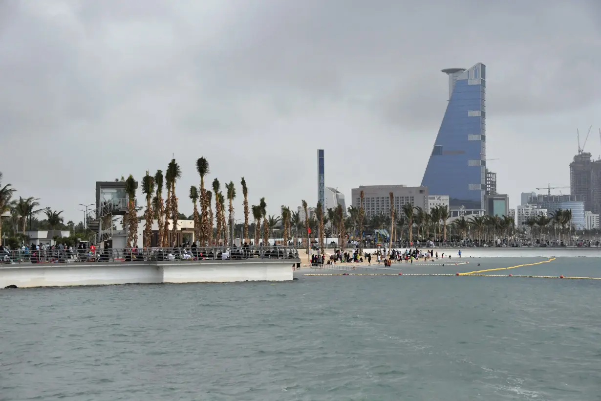 People are seen at the pier of Jeddah Waterfront, in Jeddah