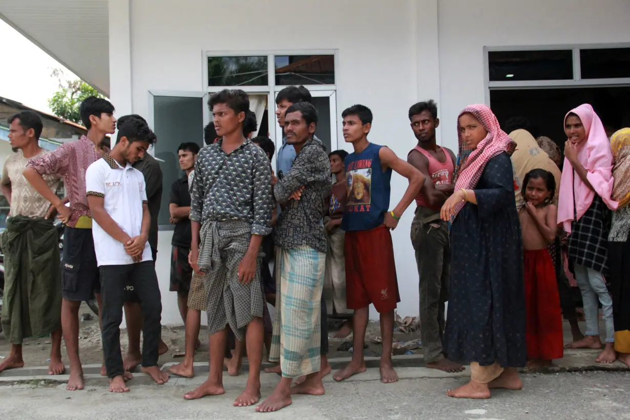 Rohingya refugees are pictured at a temporary shelter after they landed at Labu Pekan beach