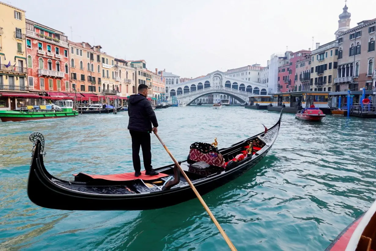 FILE PHOTO: A gondola is pictured on Grand Canal in front of Rialto bridge in Venice