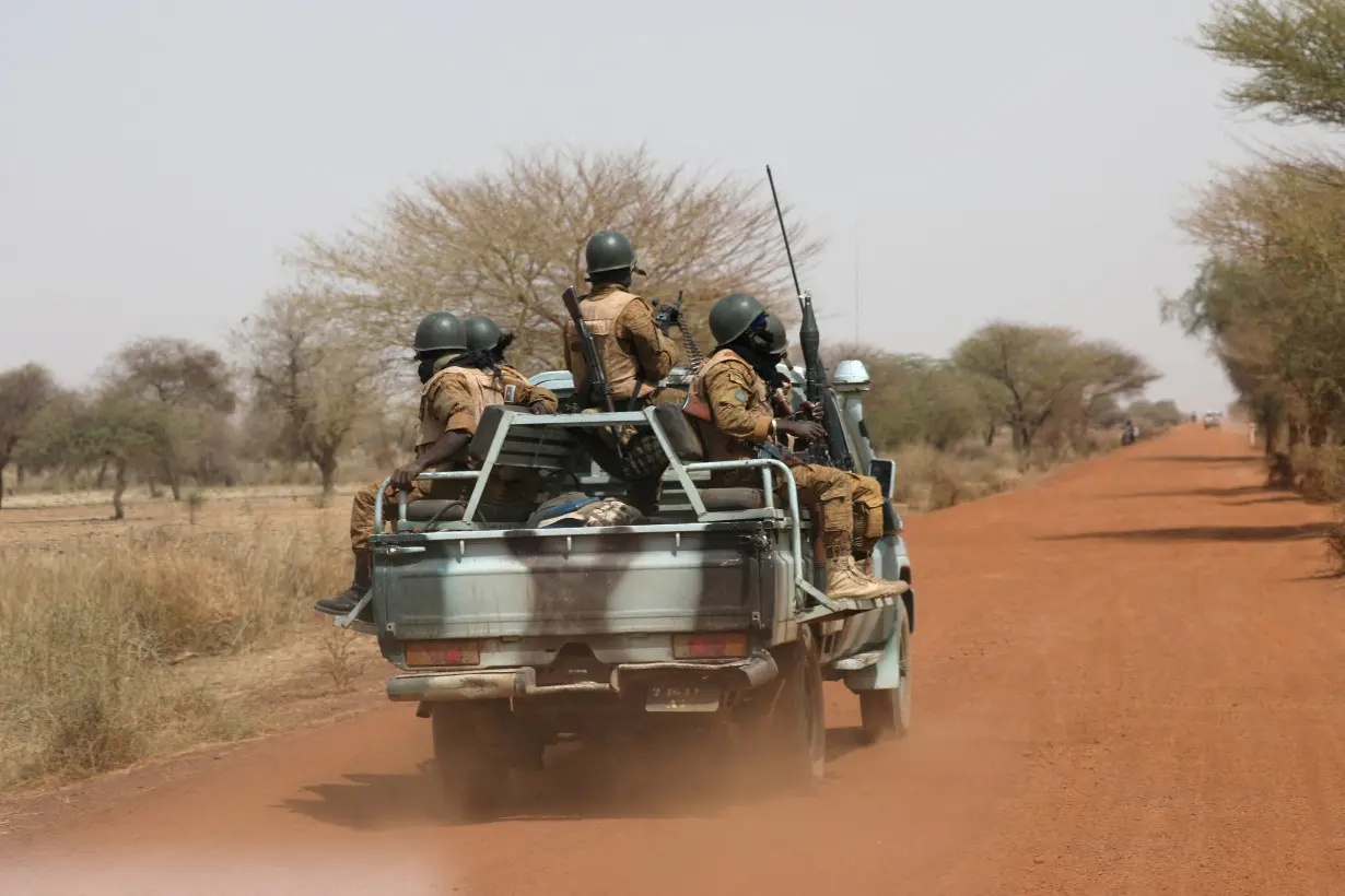 FILE PHOTO: Soldiers from Burkina Faso patrol on the road of Gorgadji in the Sahel area, Burkina Faso