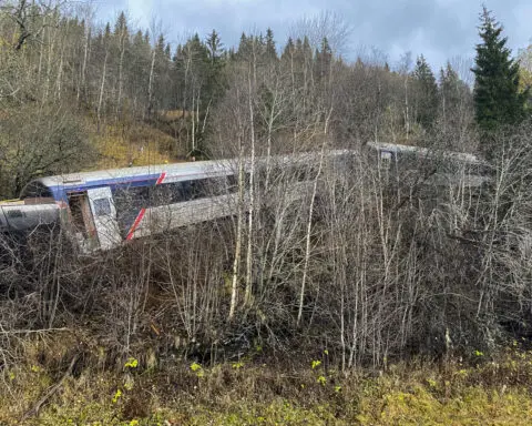 Train carrying 55 people derails on Norway's north coast, killing at least 1 person and injuring 4