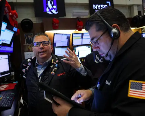 Global shares edge higher, US yields fall as strong earnings allay election worries