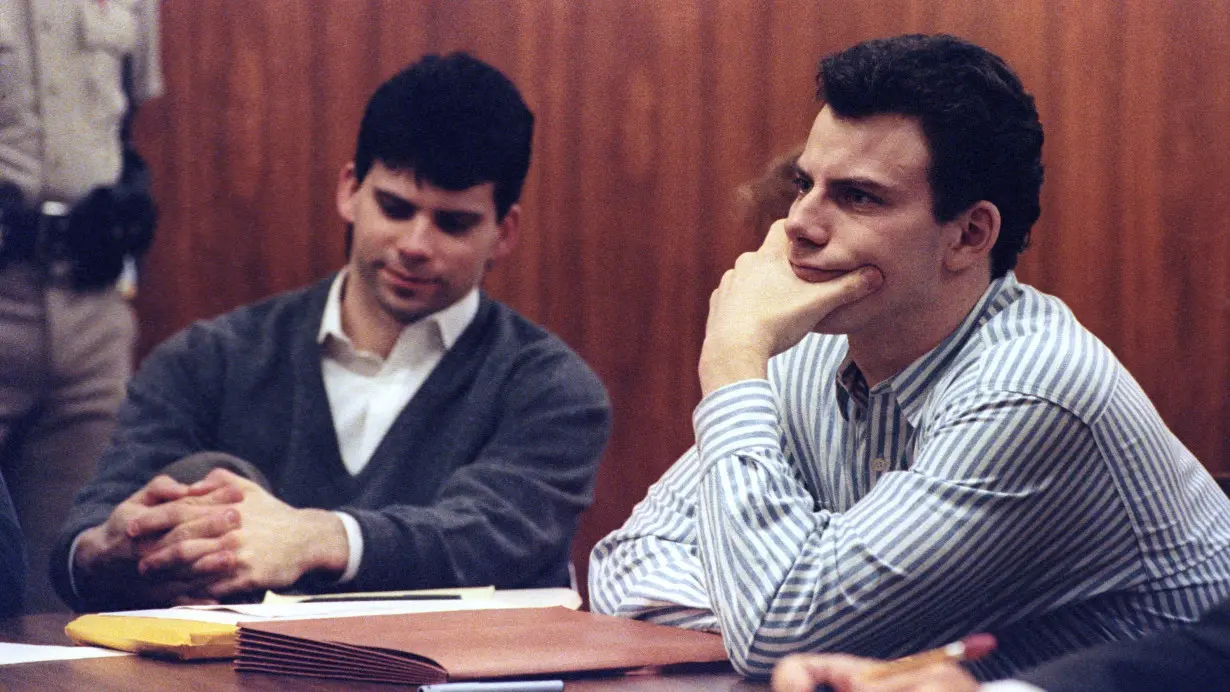 Erik Menendez (R) and brother Lyle listen to court proceedings during a May 17, 1991 appearance in the case of the shotgun murder of their wealthy parents in August 1989.