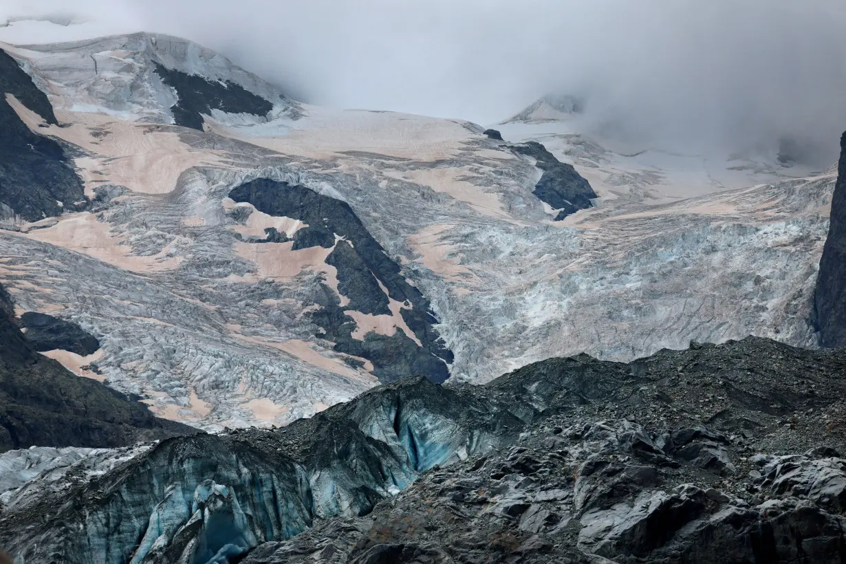 FILE PHOTO: Crevasses and Sahara dust are seen on the Morteratsch Glacier, in Pontresina