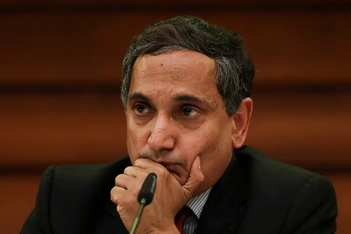 FILE PHOTO: IMF'S Krishna Srinivasan reacts during a news conference in Colombo