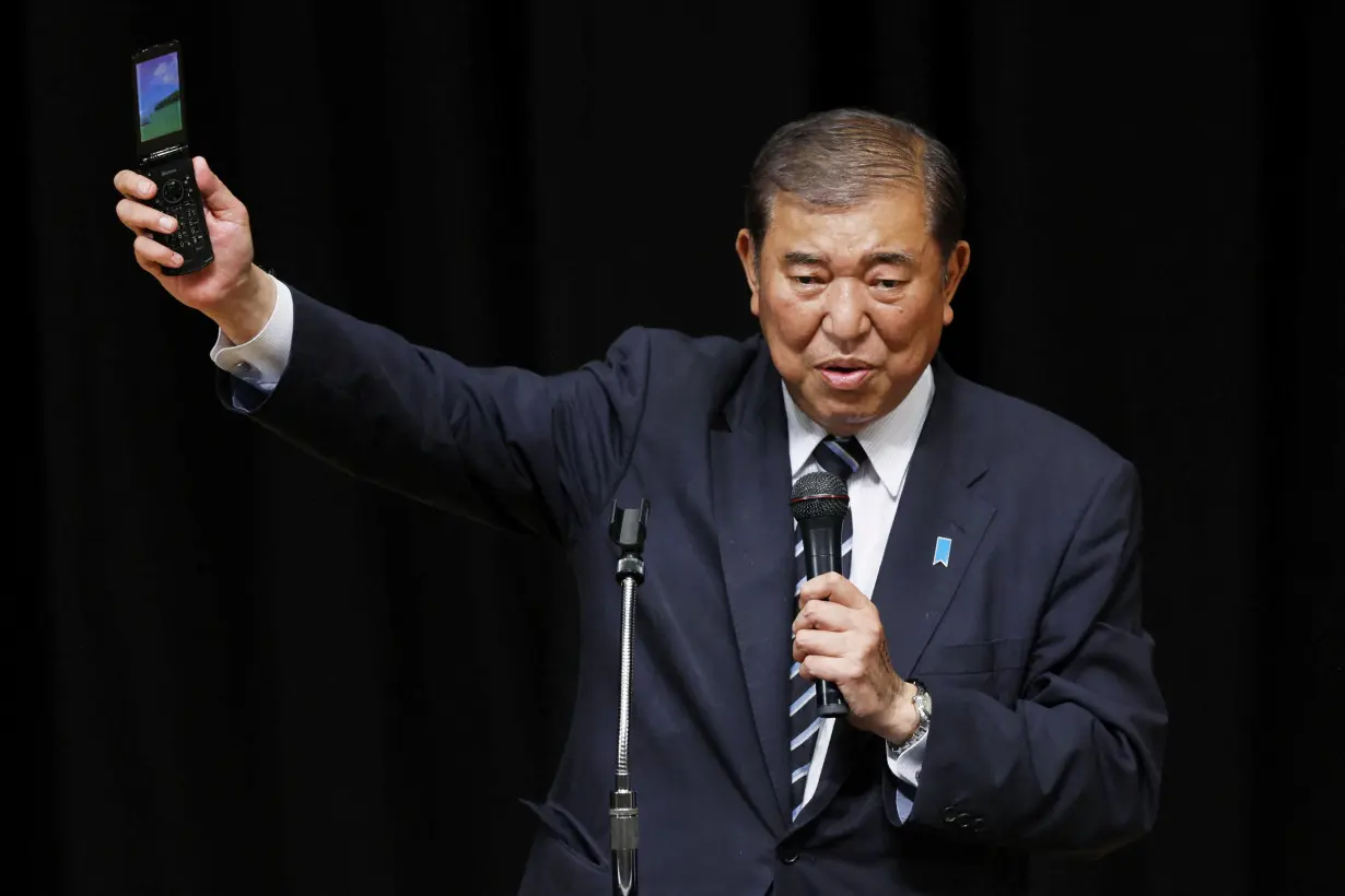 Japanese Prime Minister Shigeru Ishiba makes a speech at a campaign for the upcoming general election in Toyonaka