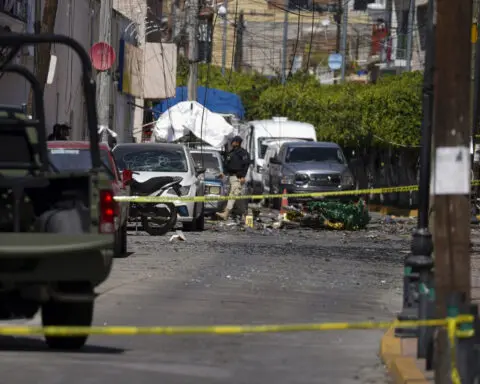 A car bomb explodes outside a police station in western Mexico, wounding 3 officers