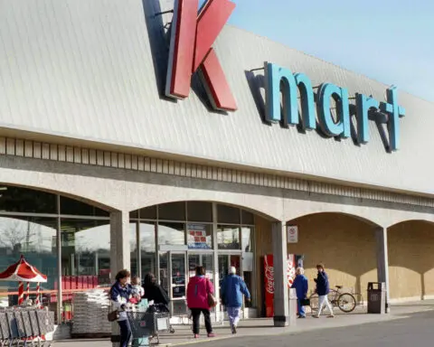 In a suburban Miami shopping center, Kmart's last 'Blue Light Specials' flicker