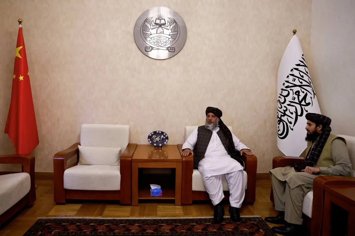 FILE PHOTO: Taliban's acting commerce minister Haji Nooruddin Azizi sits during an interview with Reuters, at the Embassy of Afghanistan in Beijing