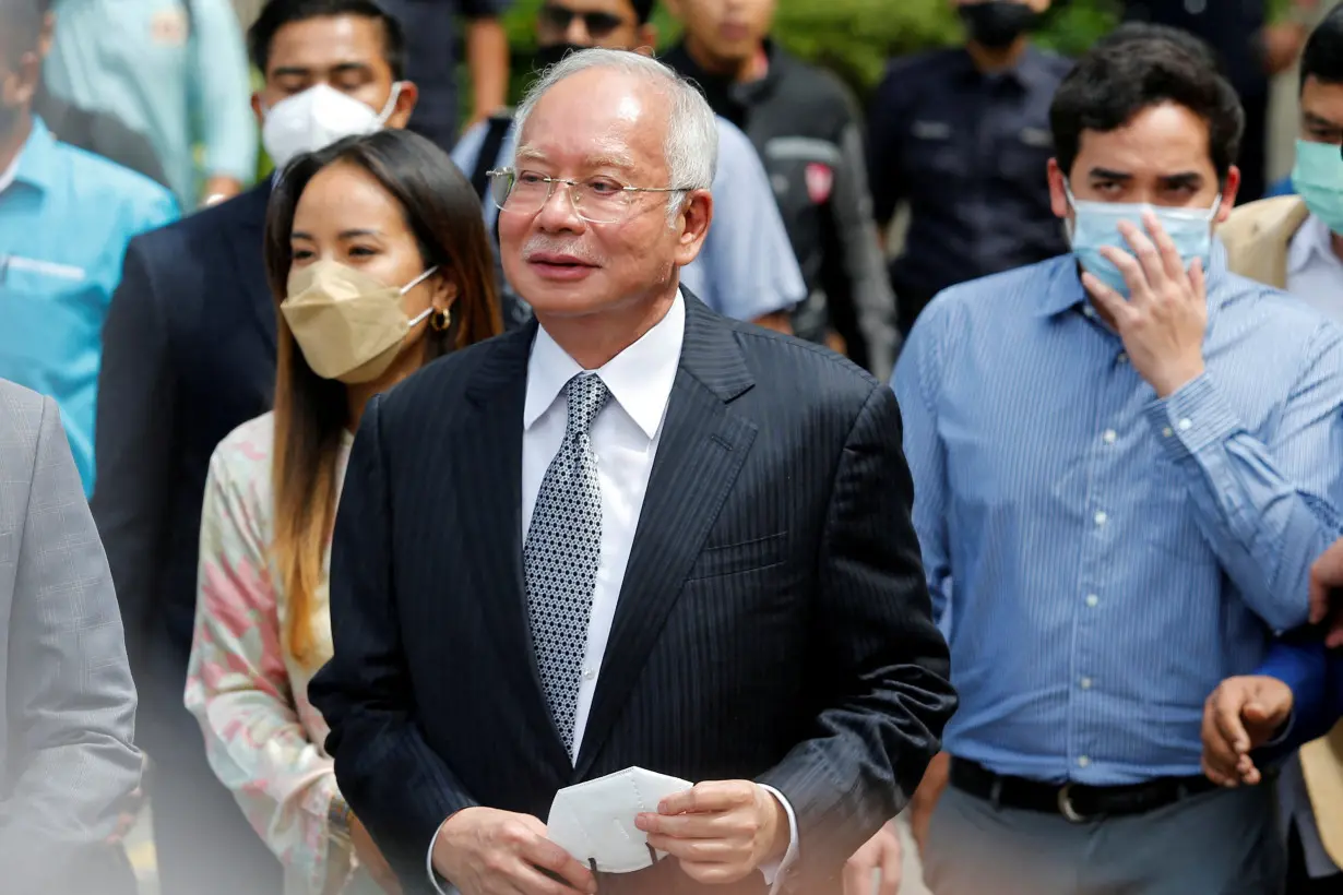 FILE PHOTO: Former Malaysian Prime Minister Najib Razak walks out from the Federal Court during a court break, in Putrajaya