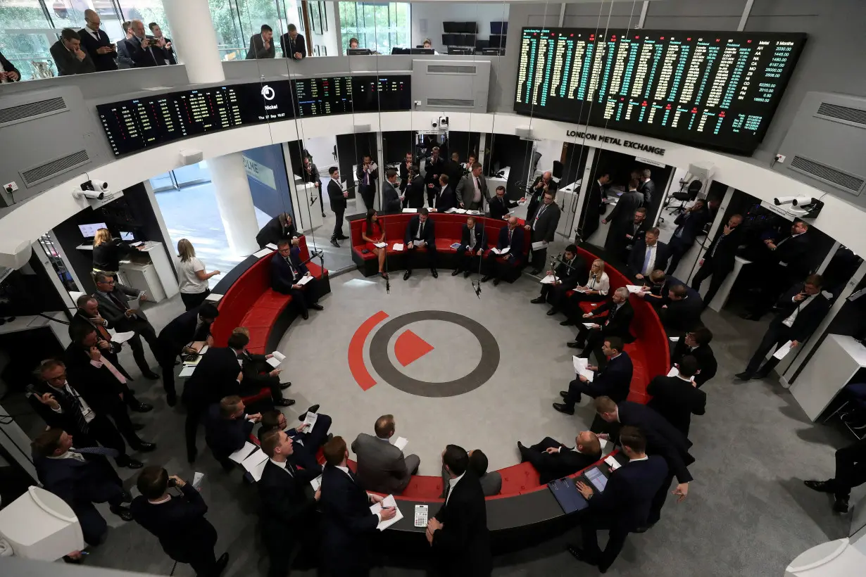 FILE PHOTO: Traders work on the floor of the London Metal Exchange in London