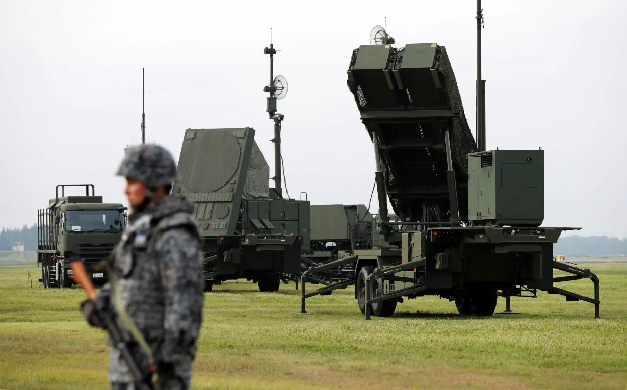 JSDF soldier takes part in a drill to mobilise their PAC-3 missile unit in response to recent missile launch by North Korea, at U.S. Air Force Yokota Air Base in Fussa