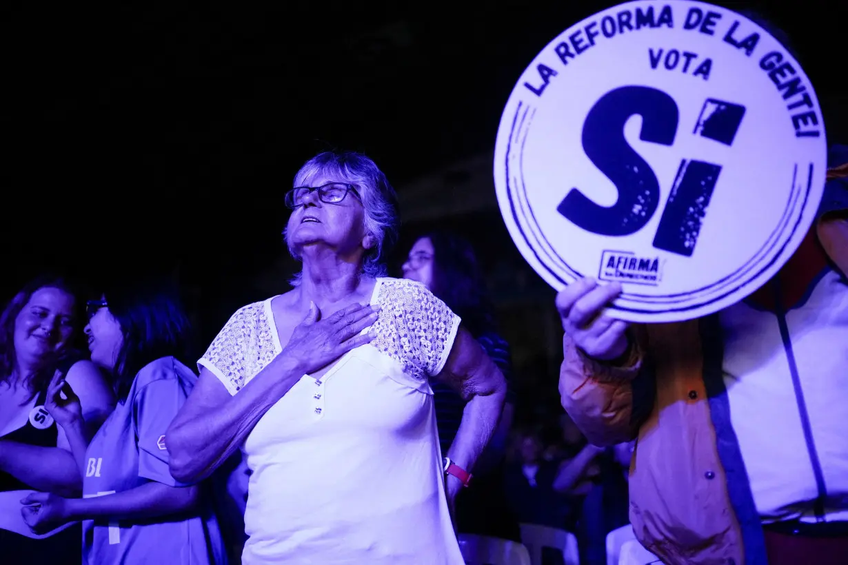 FILE PHOTO: Supporters of a referendum that seeks to push back retirement age from 65 to 60 attend a closing rally in Montevideo