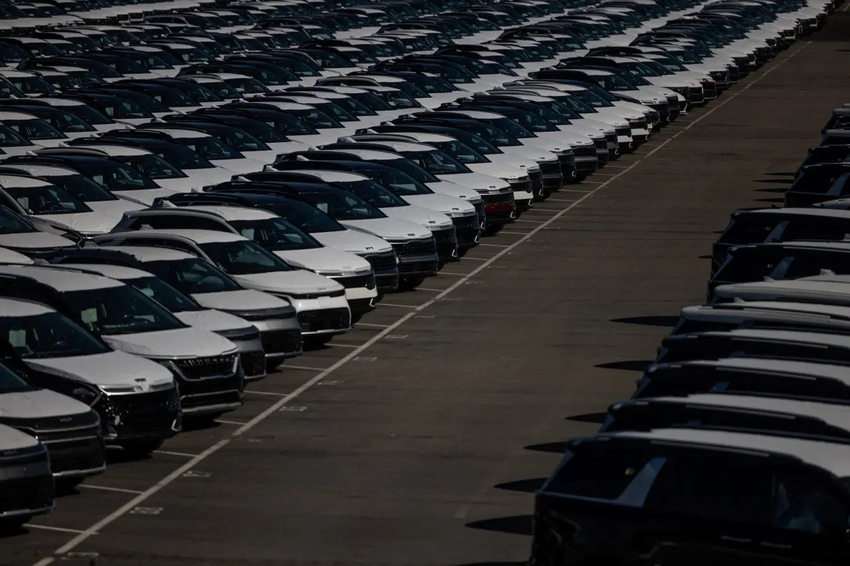 New vehicles are seen at a parking lot in the Port of Richmond, California