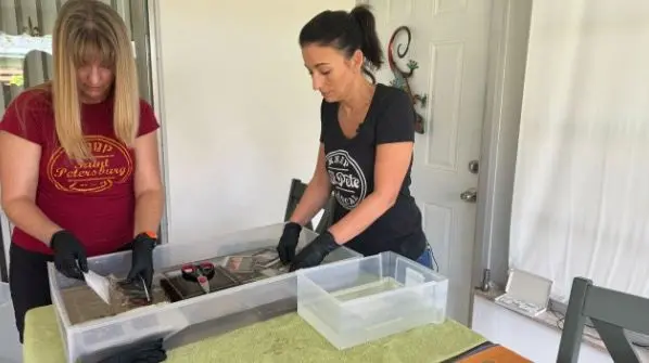 Florida women help families save photo albums damaged by recent hurricanes