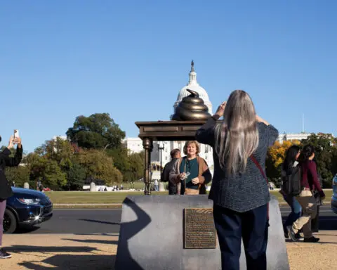 Poop-emoji statue near US Capitol evokes stain of Jan. 6 riot
