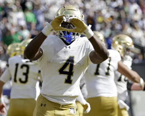 No. 12 Notre Dame knocks error-prone No. 24 Navy from unbeaten ranks