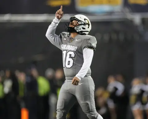 Shedeur Sanders, Travis Hunter help Colorado beat Cincinnati 34-23 to become bowl eligible