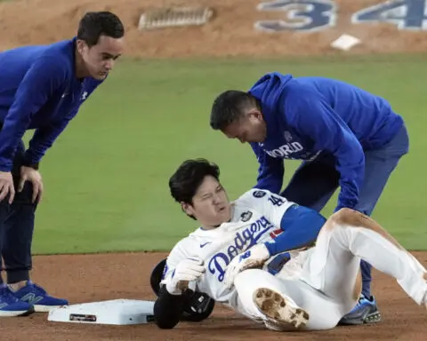 Shohei Ohtani partially dislocates left shoulder during World Series Game 2, status TBD