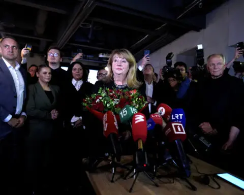 Lithuania leftist opposition win election, eyes coalition