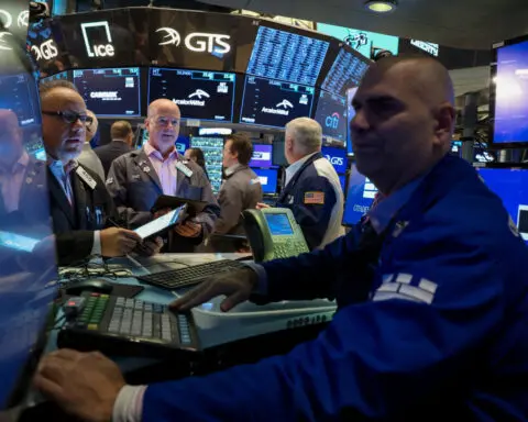 Nasdaq hits record high as Alphabet earnings beat estimates