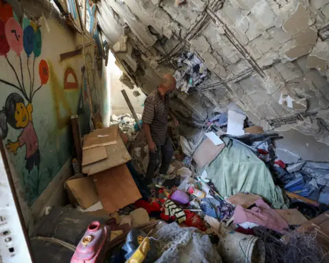 As Israel hammers north Gaza, Palestinians dig for the dead in multi-storey ruins