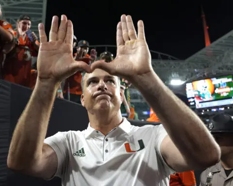 The football alumni are flooding Miami's sidelines. The unbeaten Hurricanes are seeing the benefits