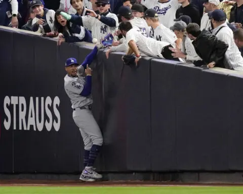 Yankee Stadium fans ejected after one pries ball out of Mookie Betts' glove at World Series