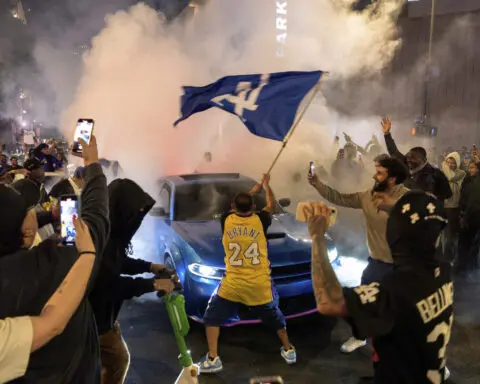 Los Angeles sees city bus burned, store thefts and rowdy crowds after Dodgers win World Series