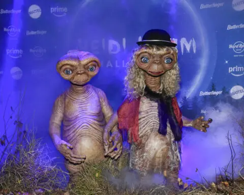 Heidi Klum and Janelle Monáe wear elaborate E.T. costumes for their Halloween parties