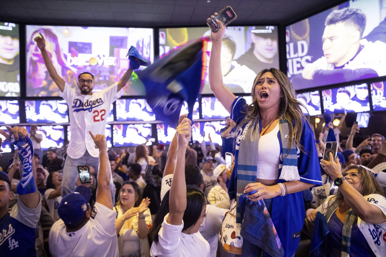 Los Angeles sees city bus burned, store thefts and rowdy crowds after Dodgers win World Series