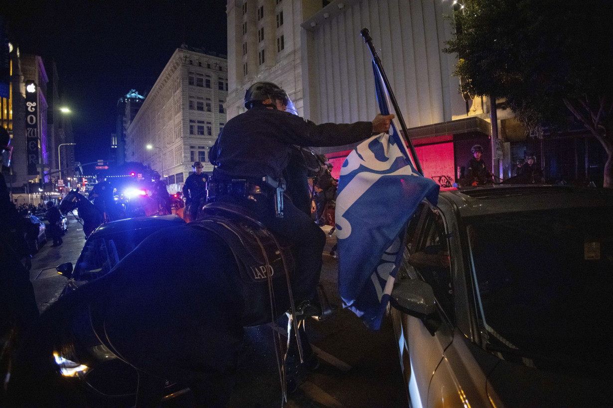 Los Angeles sees city bus burned, store thefts and rowdy crowds after Dodgers win World Series