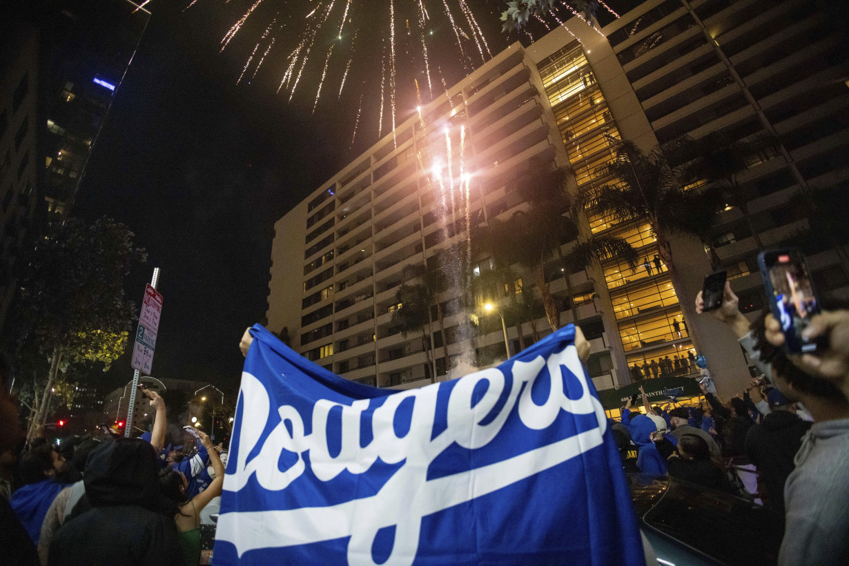 Los Angeles sees city bus burned, store thefts and rowdy crowds after Dodgers win World Series