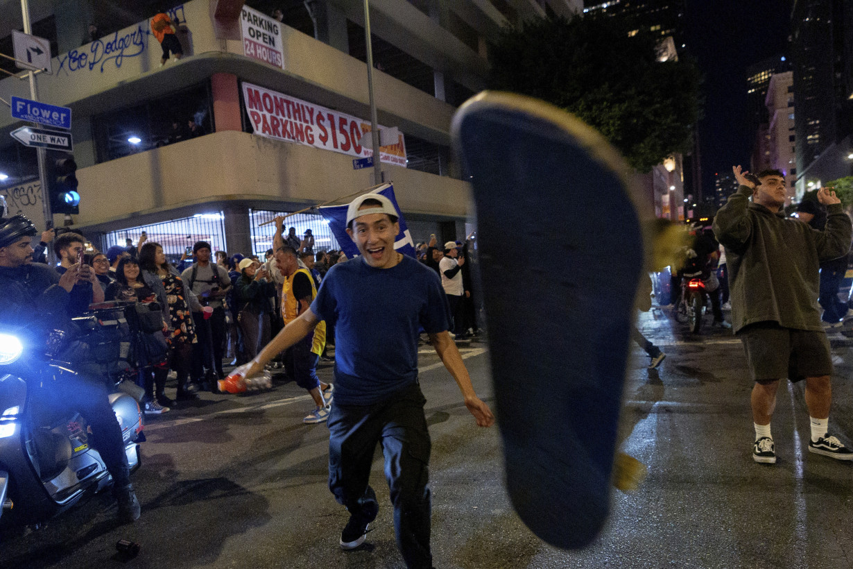 Los Angeles sees city bus burned, store thefts and rowdy crowds after Dodgers win World Series