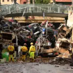 Boats and cars block roads after deadly flooding in Spain