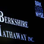 Berkshire's cash sets record as Buffett sells Apple, BofA; operating profit falls