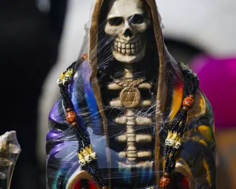 A leader of Mexican folk saint cult 'La Santa Muerte' is killed at an altar to the skeletal figure