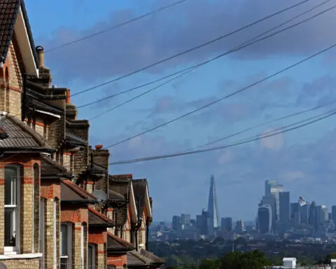 UK house prices hit record high but rise by least in 3 months, Halifax says