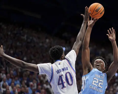 No. 1 Kansas blows big lead, holds off No. 9 North Carolina in tussle of hoops heavyweights